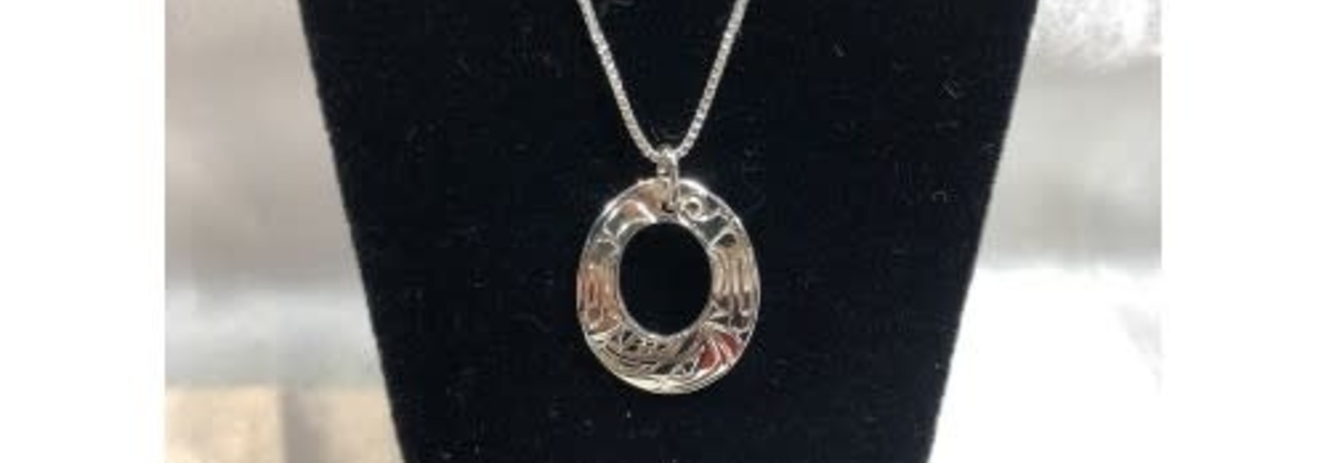 Silver Carved Oval Wolf Pendant