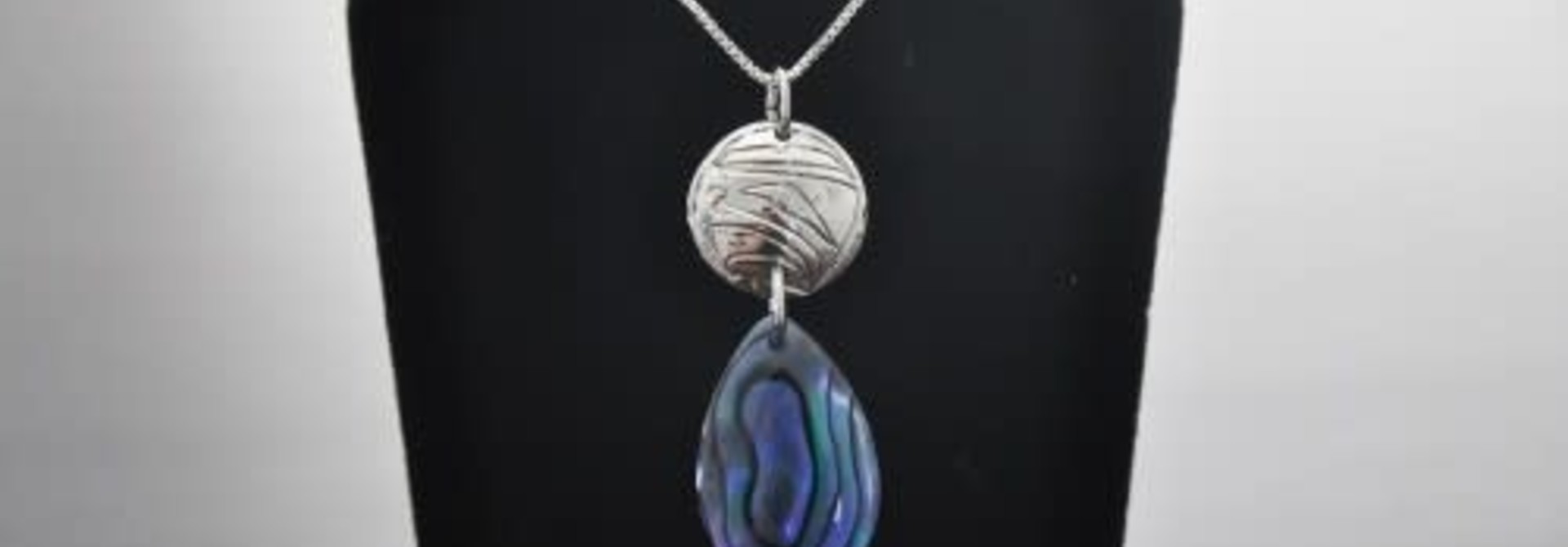 Silver Carved Eagle Pendant with Paua Shell by Nancy Dawson