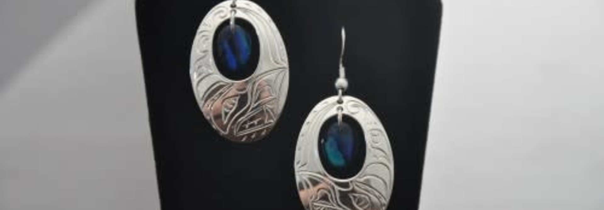 Silver Carved Oval Eagle Earrings with Blue Paua Shell by Vincent Henson