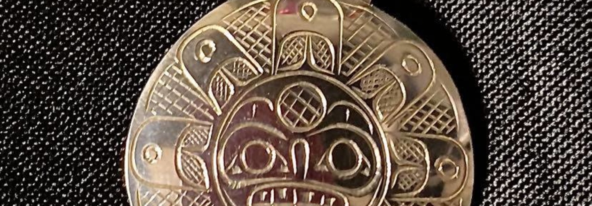 Hand Carved Silver "Sun" Pendant by Travis Henry