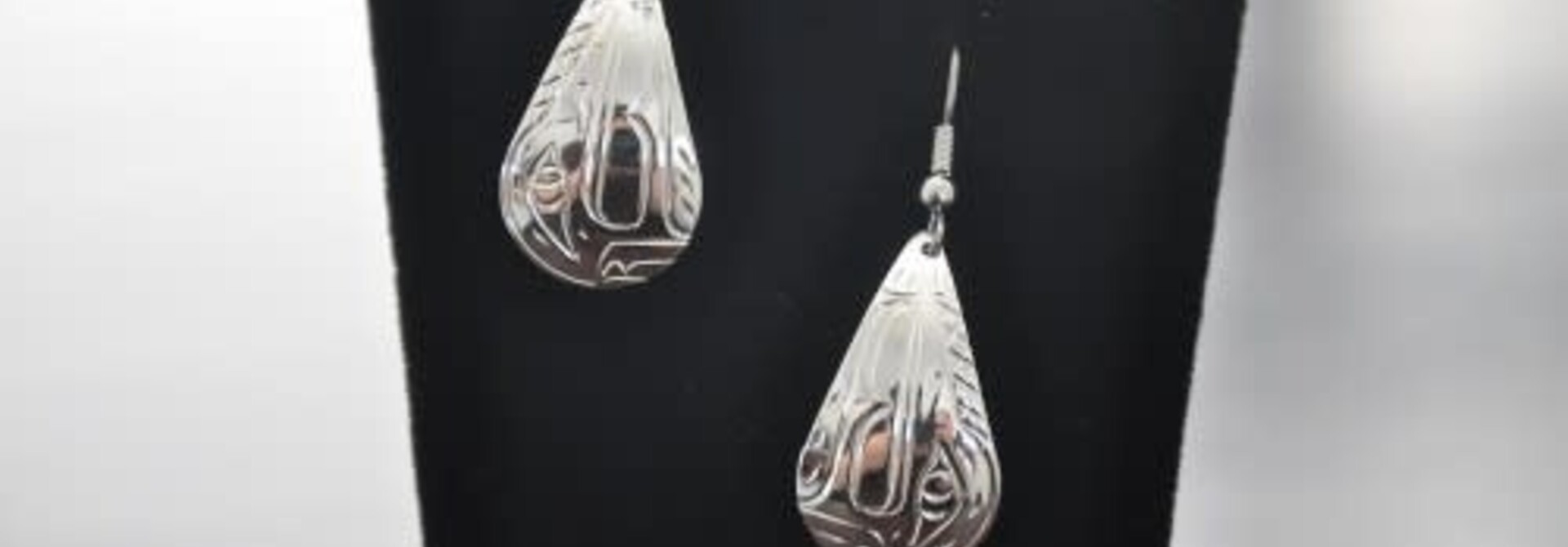 Silver Carved Wolf earrings by Vincent Henson
