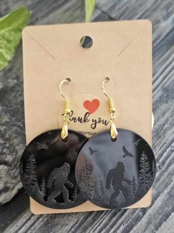 Acrylic engraved round Sasquatch earring by Stacey Smith