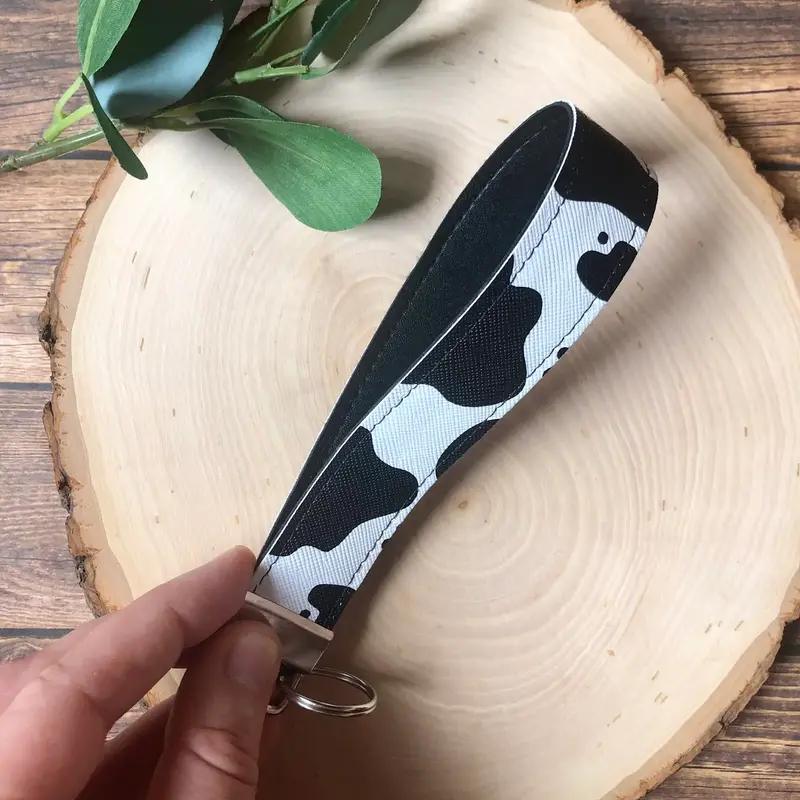 South Coast Sewn Cow Print Keychain Wristlet Faux Leather - Black