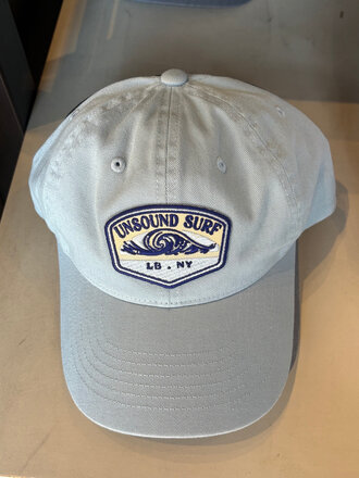 UNSOUND SURF BLUE RIDGE WAVE BADGE DAD HAT