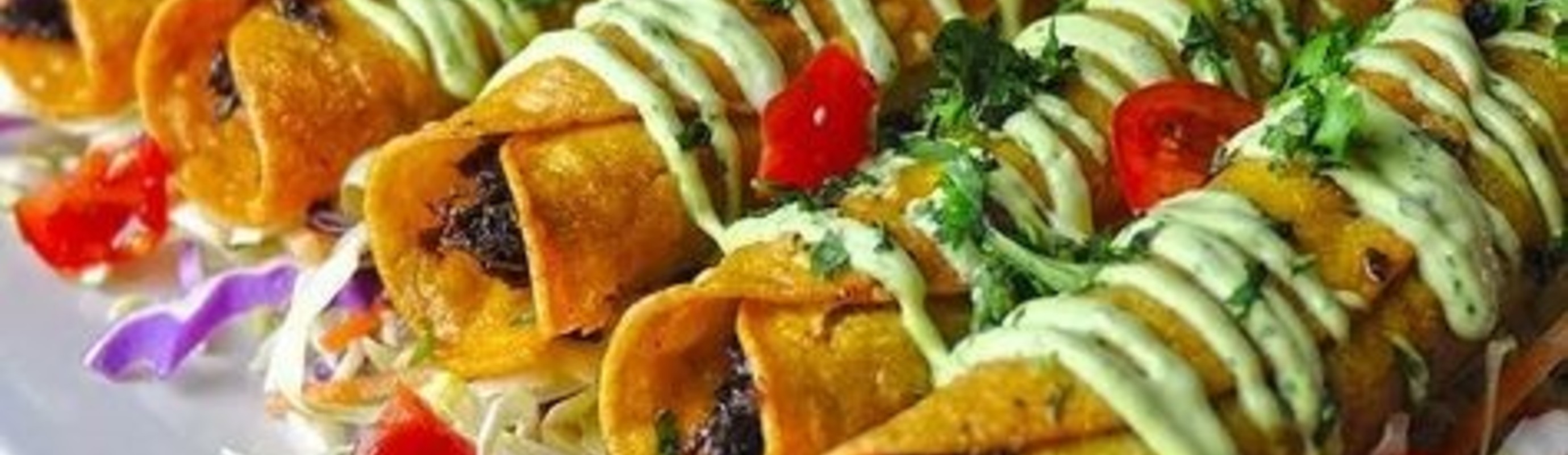 Chicken Flautas With Avocado Crema and Ancho Chile and Tamarind Sauce