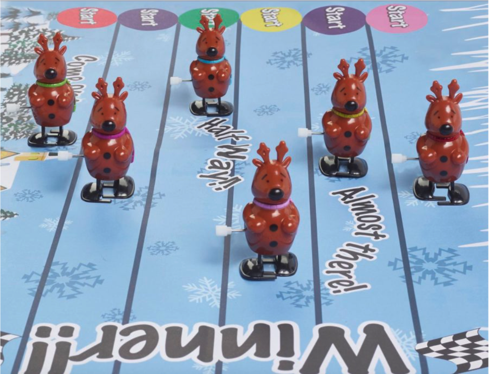 Wind-up reindeer racing on a race track, which is included in Robin Reed's Racing Reindeer Christmas Crackers. 