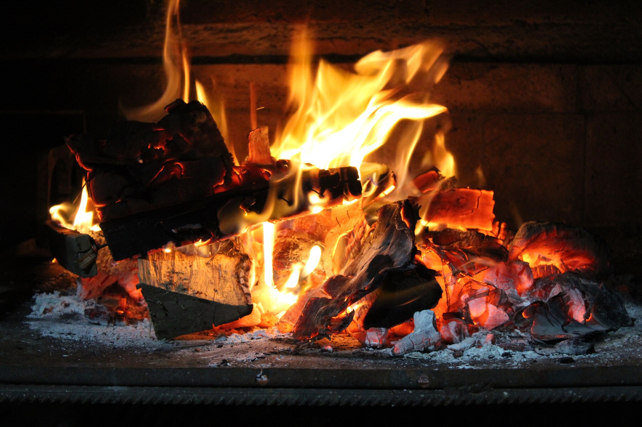 A fire burning in a fireplace. 