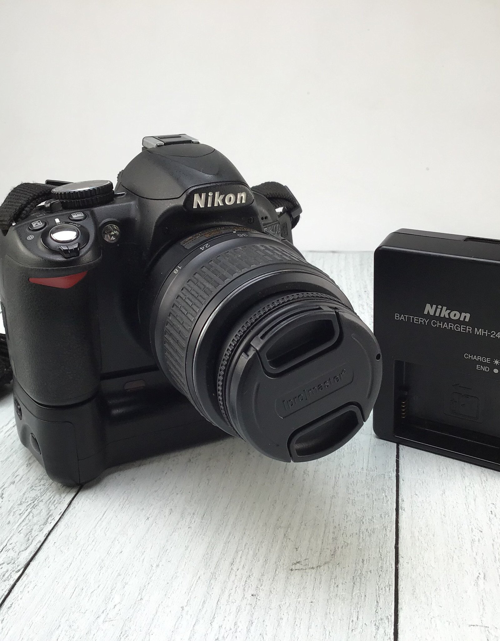 NIKON Nikon D3100 Camera w/ 18-55mm, Digipower Grip Used Fair