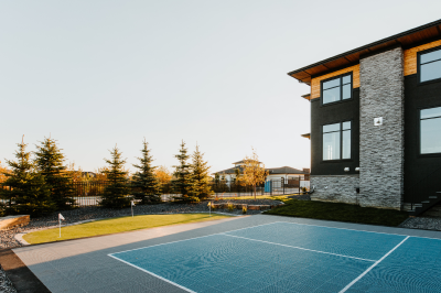 Image of a tennis court and Bella Turf putting green.