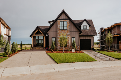 Image of a front lawn with mulch and hardscapes.