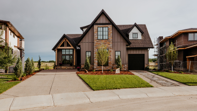 Image of a front lawn with mulch and hardscapes.