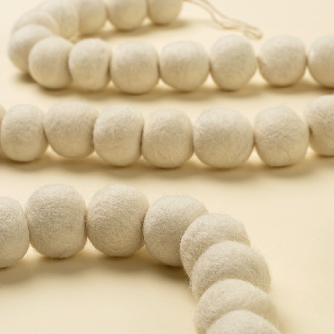 Indaba Trading Co. Cream Pom Pom Felt Garland