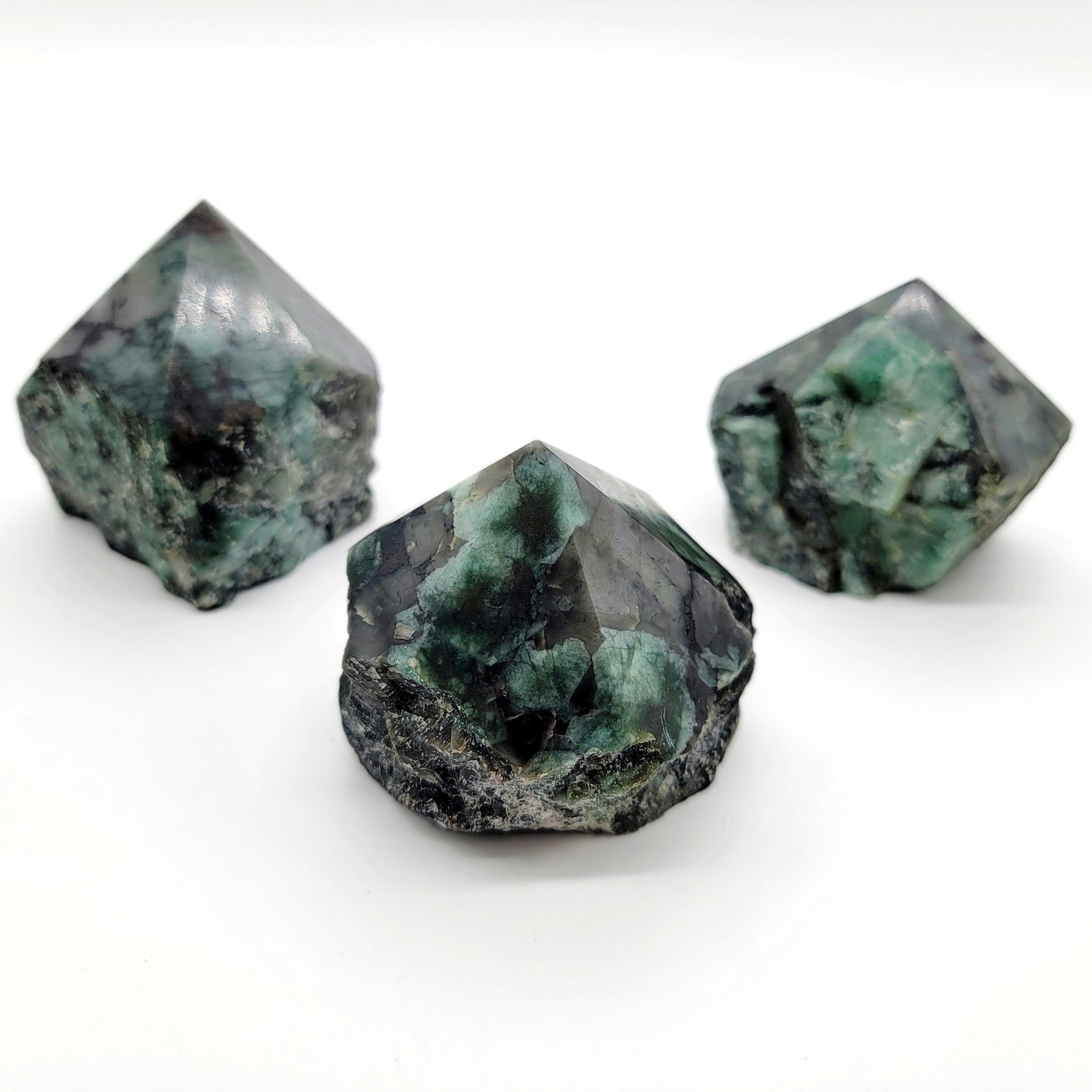 Raw Emerald Chunks with Polished Points