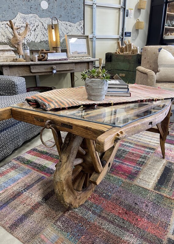 Vintage Dutch  Wheelbarrow Cart with Modern Glass Top installed to create a Coffee Table