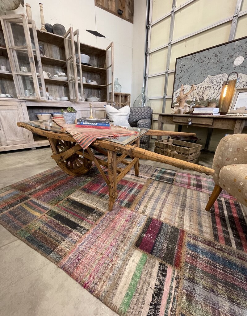 Vintage Dutch  Wheelbarrow Cart with Modern Glass Top installed to create a Coffee Table