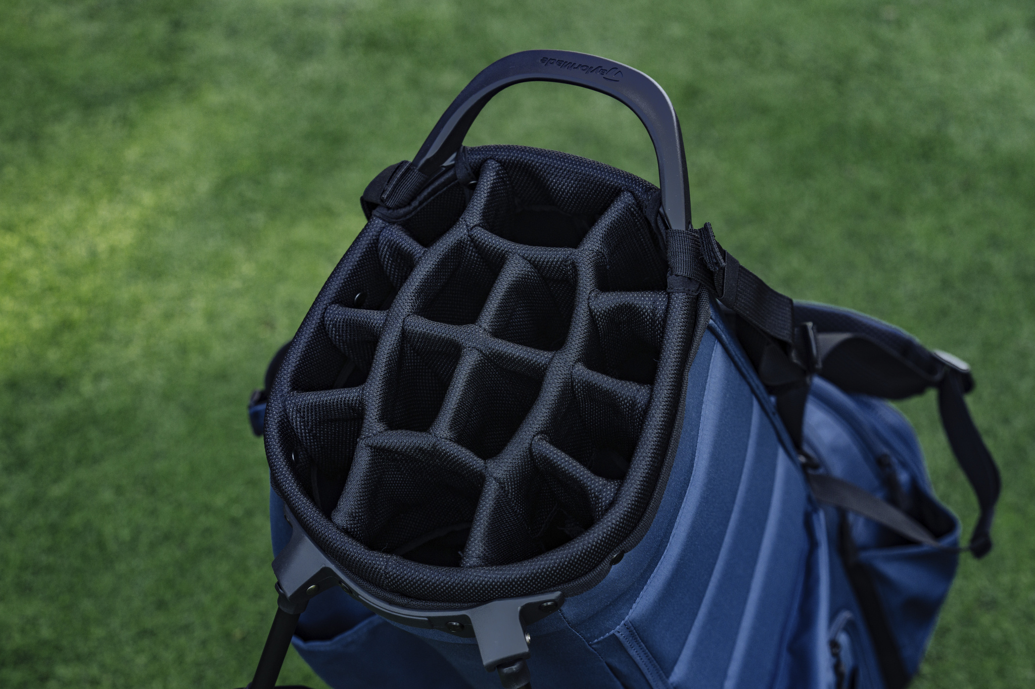 Golf bag dividers, showcasing multiple compartments to organize clubs and accessories, preventing damage and making it easy to access equipment during play