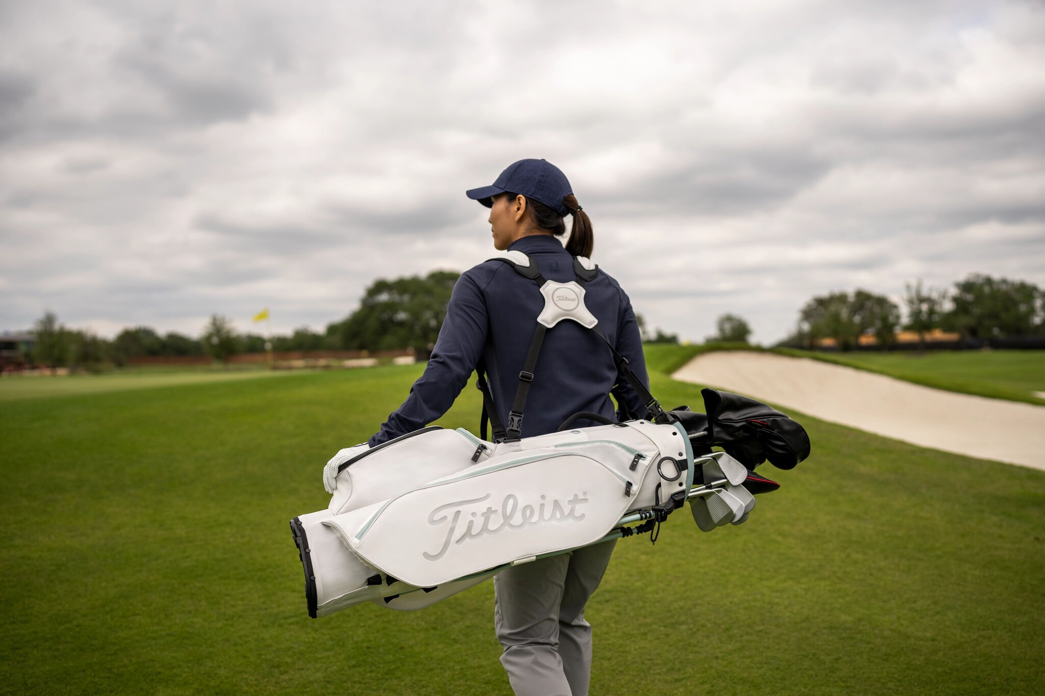 Golf bag carrying straps, featuring ergonomic designs and adjustable padding for comfortable carrying and balanced weight distribution while walking the course