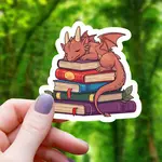 Mimic Gaming Co Sticker: Dragon Sleeping on Pile of Books - 3"