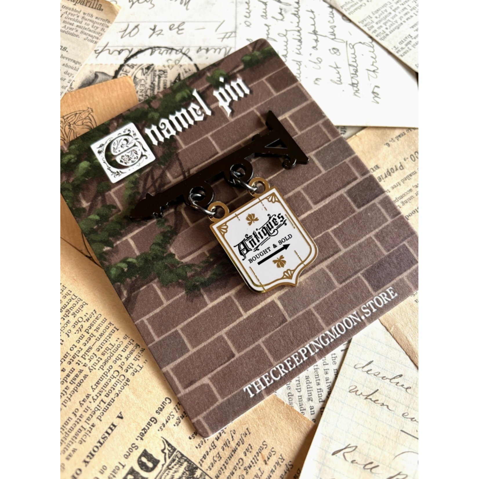 The Creeping Moon Enamel Pin - Antique Shop Sign