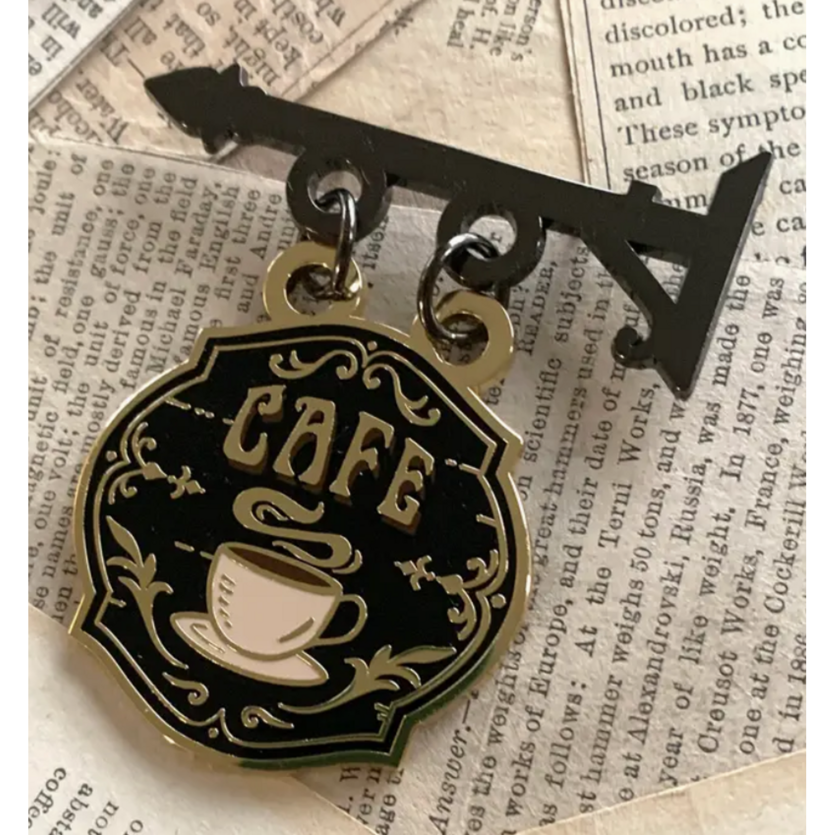 The Creeping Moon Enamel Pin - Cafe Shop Sign