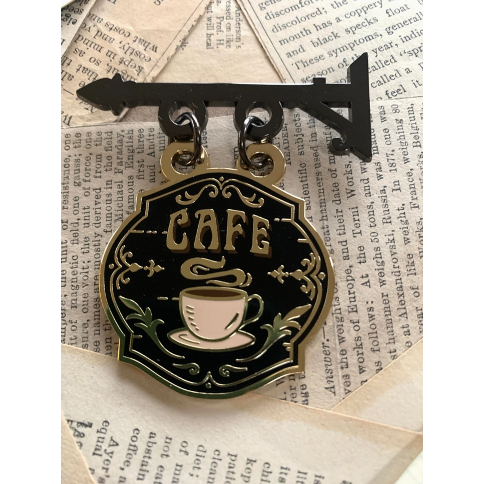 The Creeping Moon Enamel Pin - Cafe Shop Sign