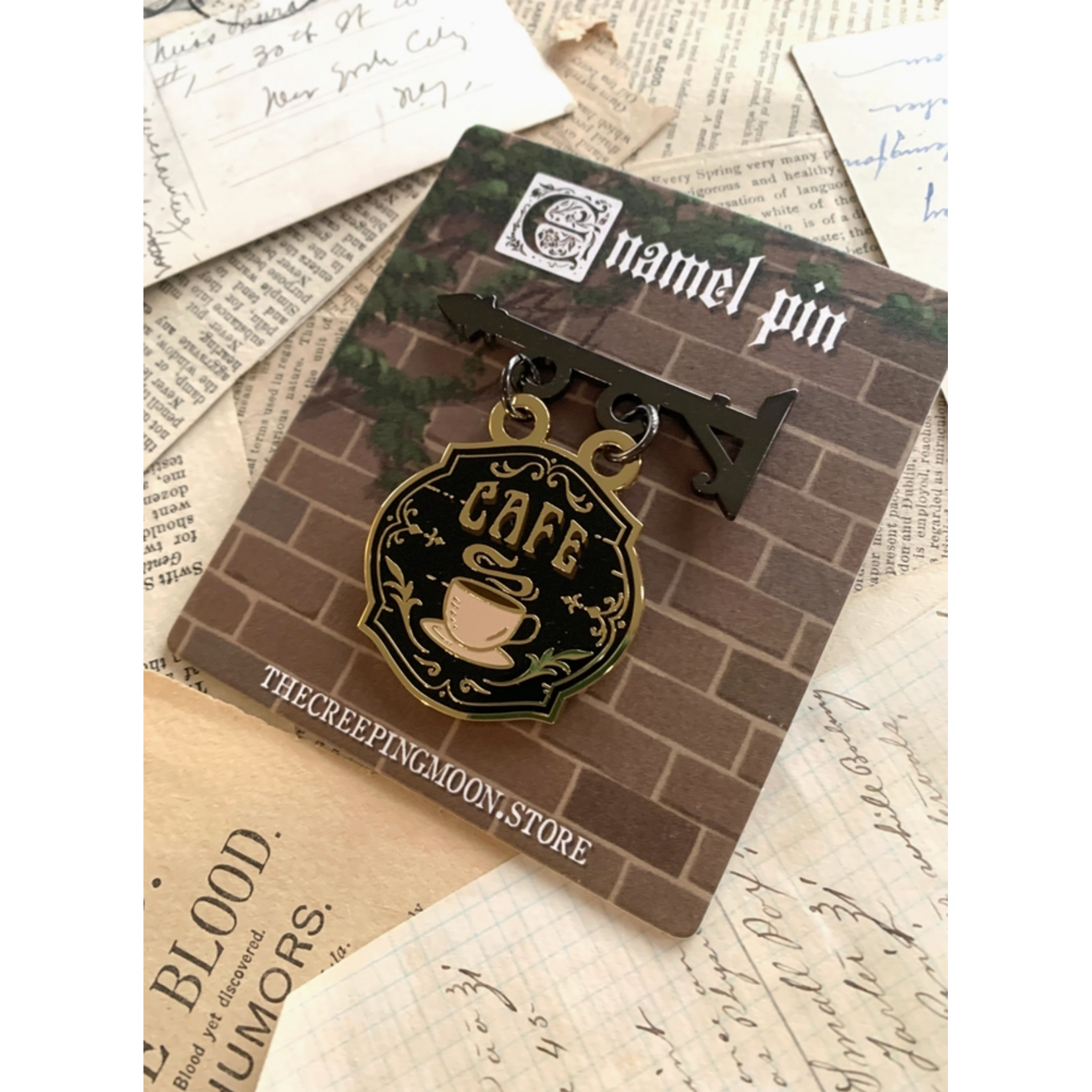 The Creeping Moon Enamel Pin - Cafe Shop Sign