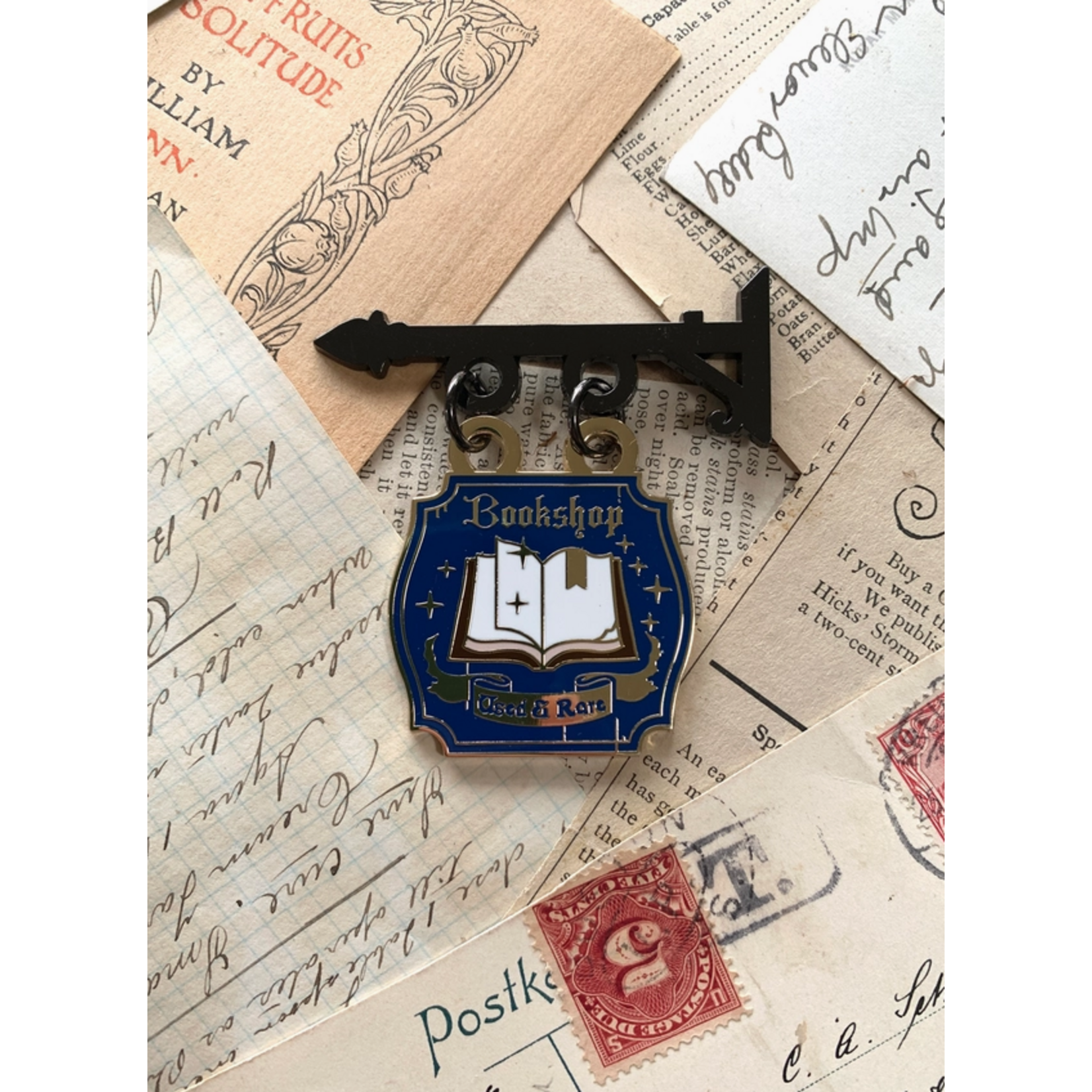 The Creeping Moon Enamel Pin - Bookshop Sign