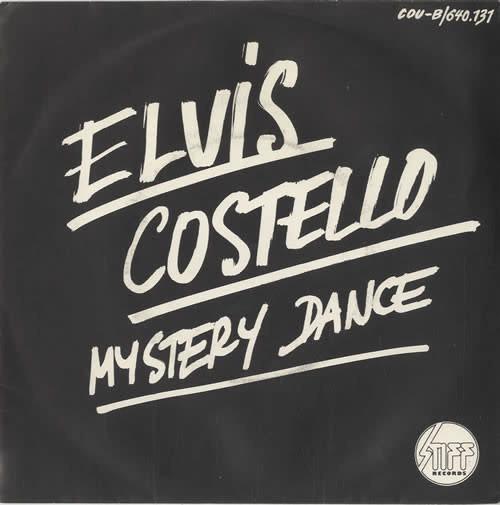 Rock/Pop Elvis Costello - Mystery Dance ('77 Belgium, Orange Vinyl 7") (VG+/creases)