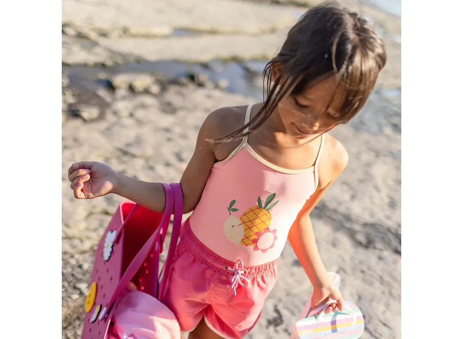 Reversible pink/yellow one piece swimsuit fruit print