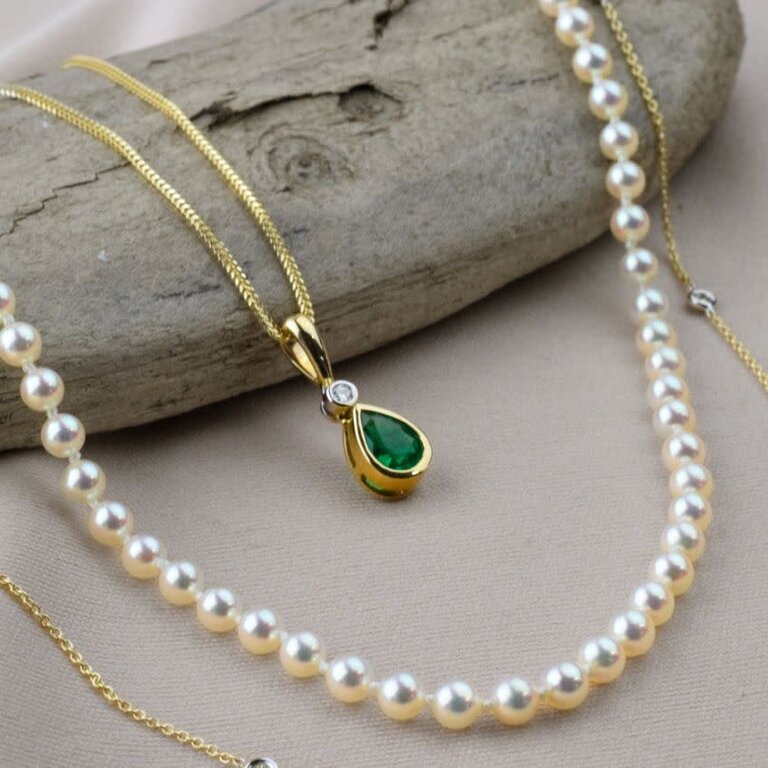 Expressions Jewelers 14k Pear Shape Emerald & Diamond Bezel Pendant