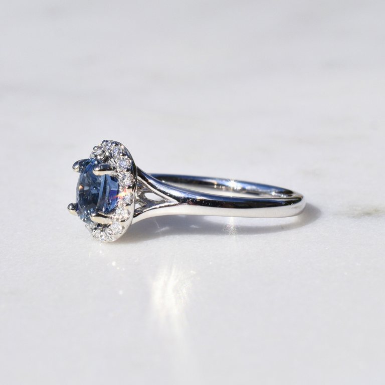 Expressions Jewelers Sapphire and Diamond Halo Ring
