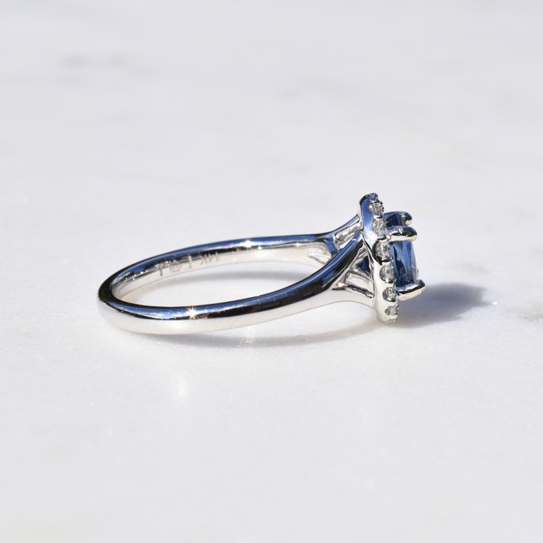 Expressions Jewelers Sapphire and Diamond Halo Ring
