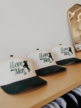 RAW AND REBELLIOUS I LOVE MEN TRUCKER HAT