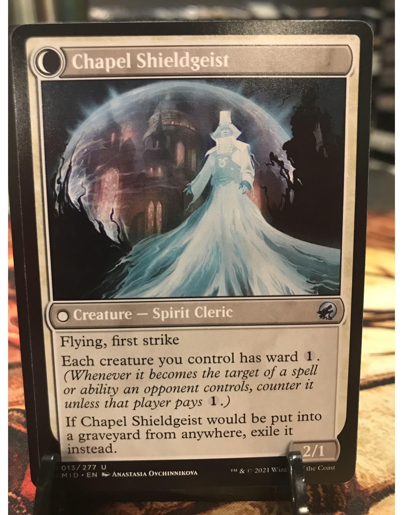 Magic Chaplain of Alms // Chapel Shieldgeist  (MID)