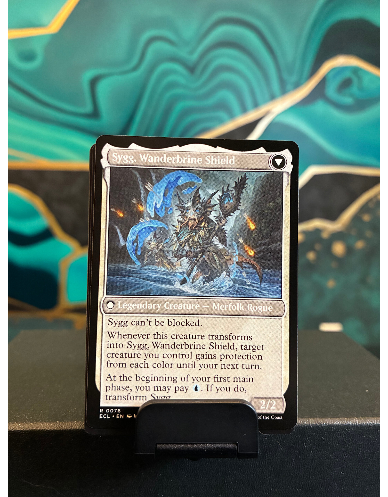 Sygg, Wanderwine Wisdom // Sygg, Wanderbrine Shield  (ECL)