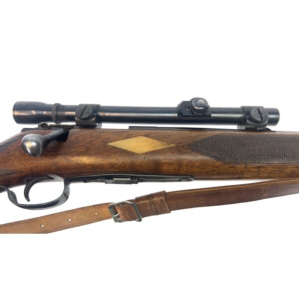 Winchester Model 75 22LR Repeater, Very Good Condition, Bore is Excellent, made in 1949, Stock customized with Dall Sheep Horn Inlays, Fitted with Weaver 4x 3/4" Scope