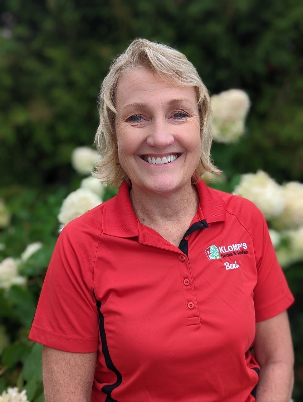 The Owner, Barb Klomp, wearing a Klomp’s collared t-shirt. 