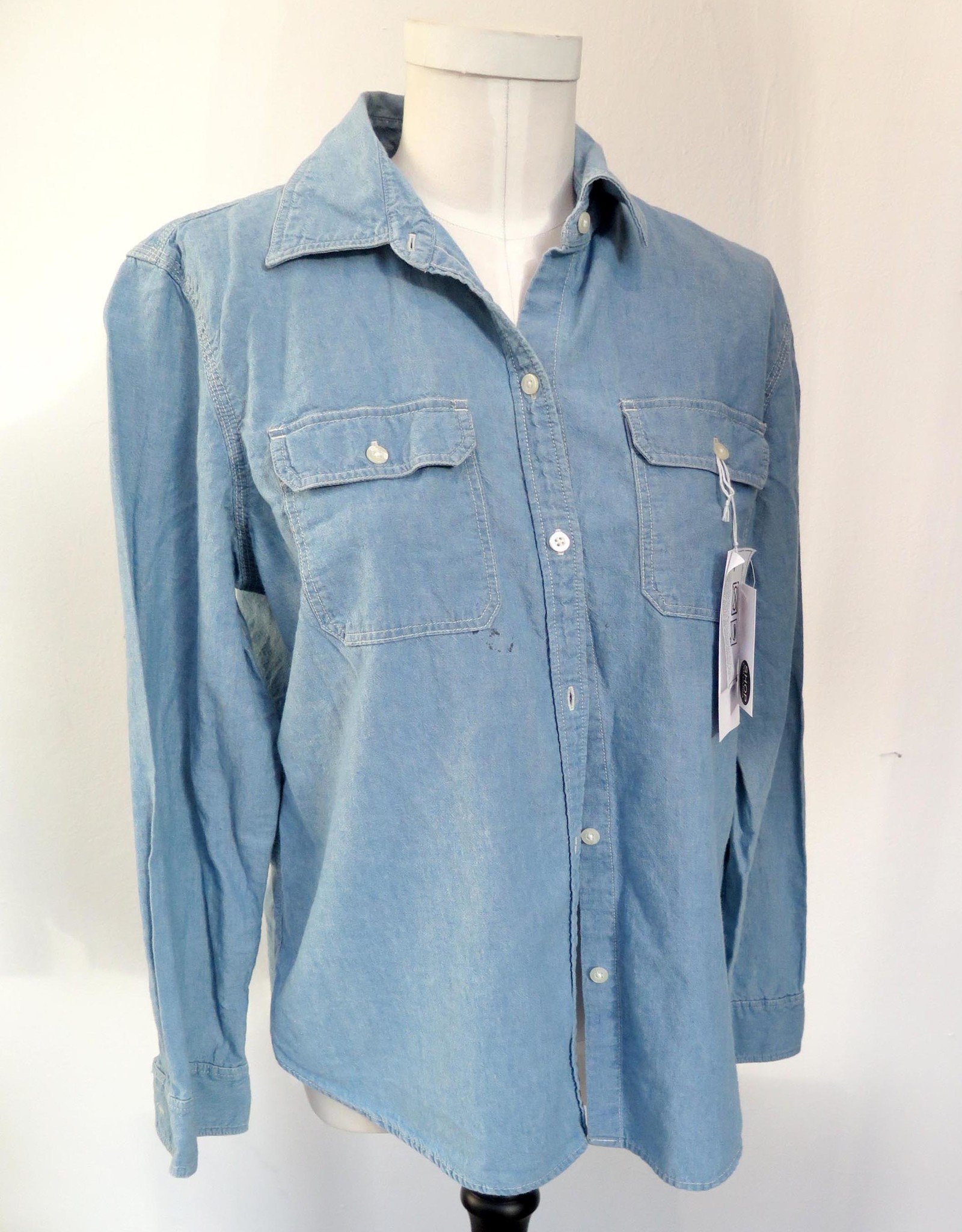 Here & Now” textile paint on denim shirt by AMCV - Columbia