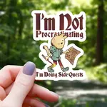 Mimic Gaming Co Sticker Cat Doing Side Quests (3")