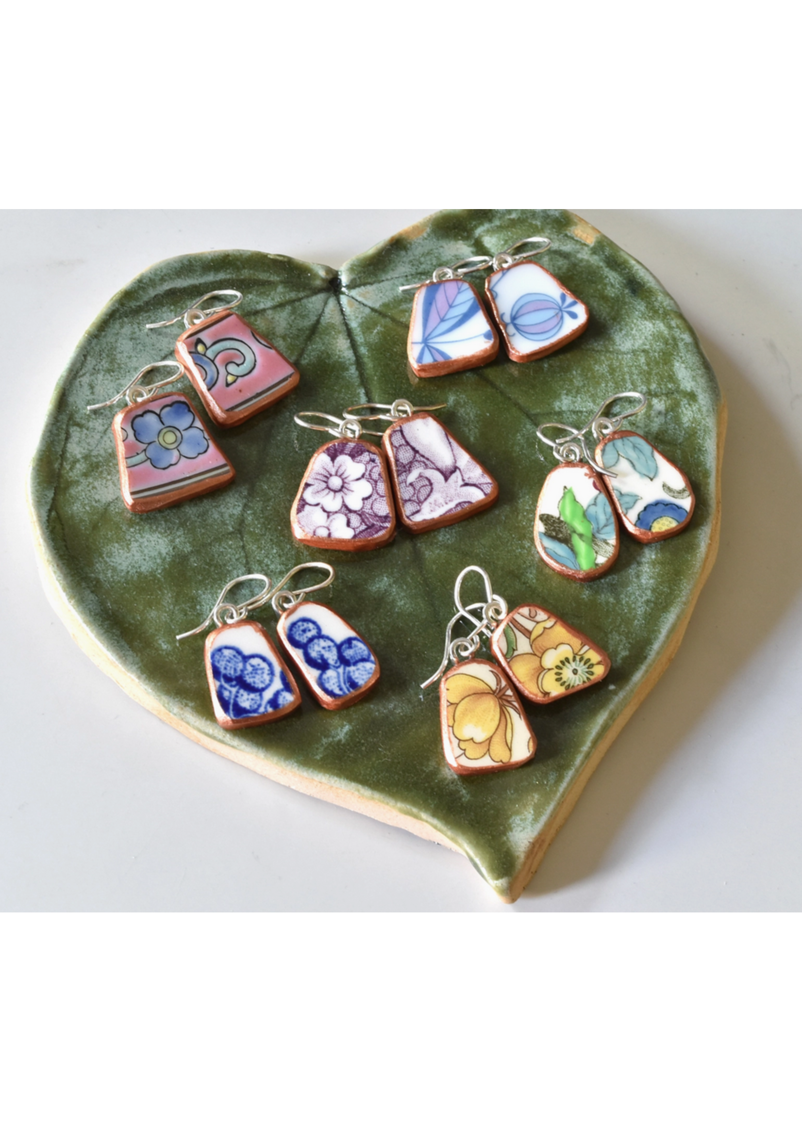 the broken plate co The Broken Plate Dangle Earring  Shard Shape Mixed Patterns Rose Gold Porcelain Paint