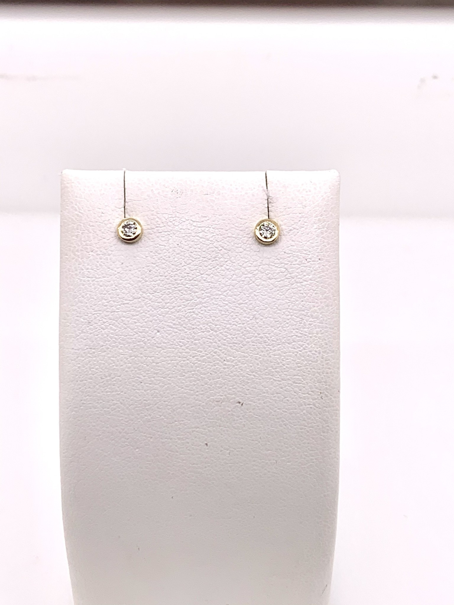 14K yellow gold bezel set diamond stud earrings