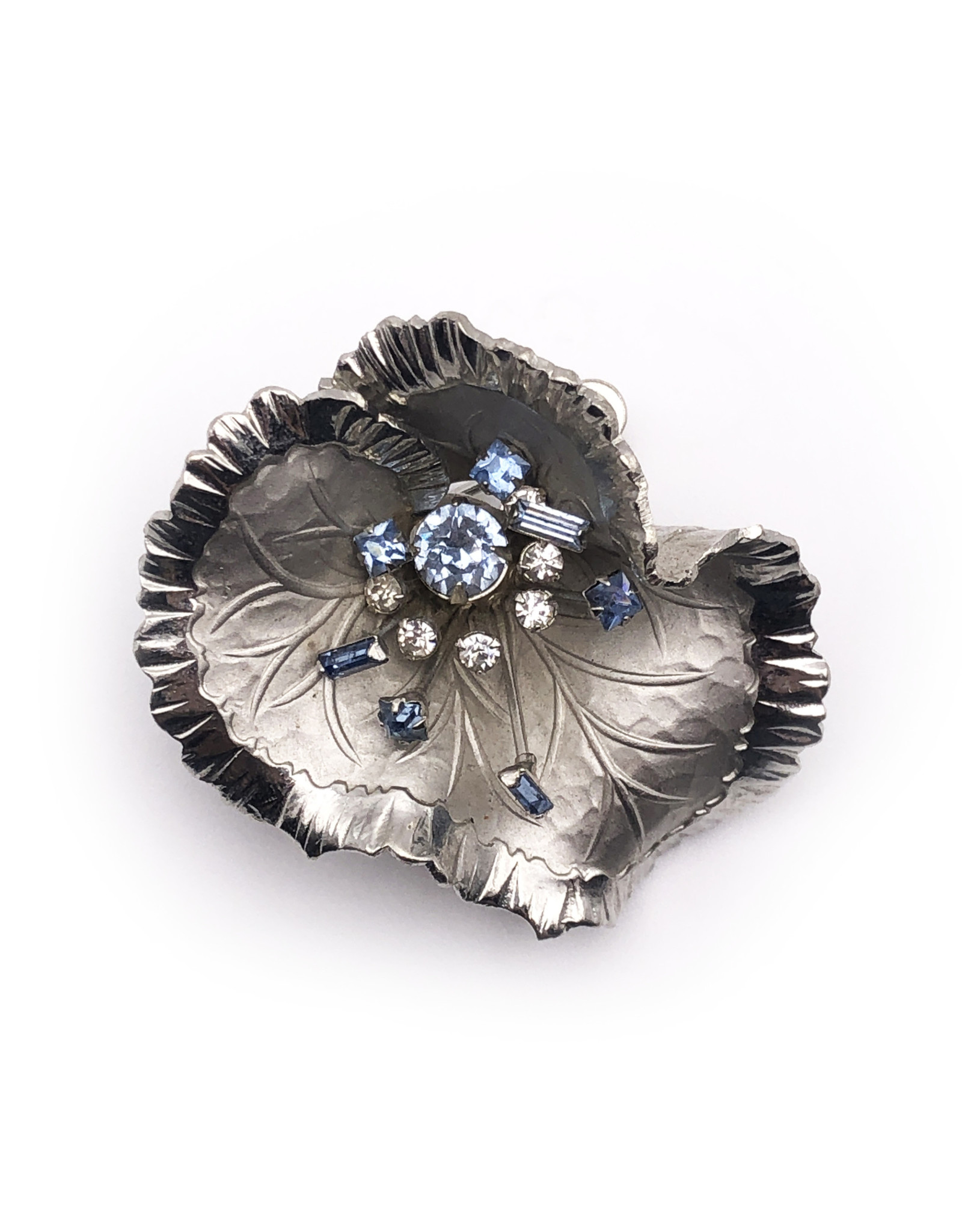 Silver Colored Metal Wavy Flower Brooch with Spray of White & Blue Rhinestones