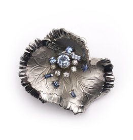 Silver Colored Metal Wavy Flower Brooch with Spray of White & Blue Rhinestones