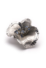 Silver Colored Metal Wavy Flower Brooch with Spray of White & Blue Rhinestones