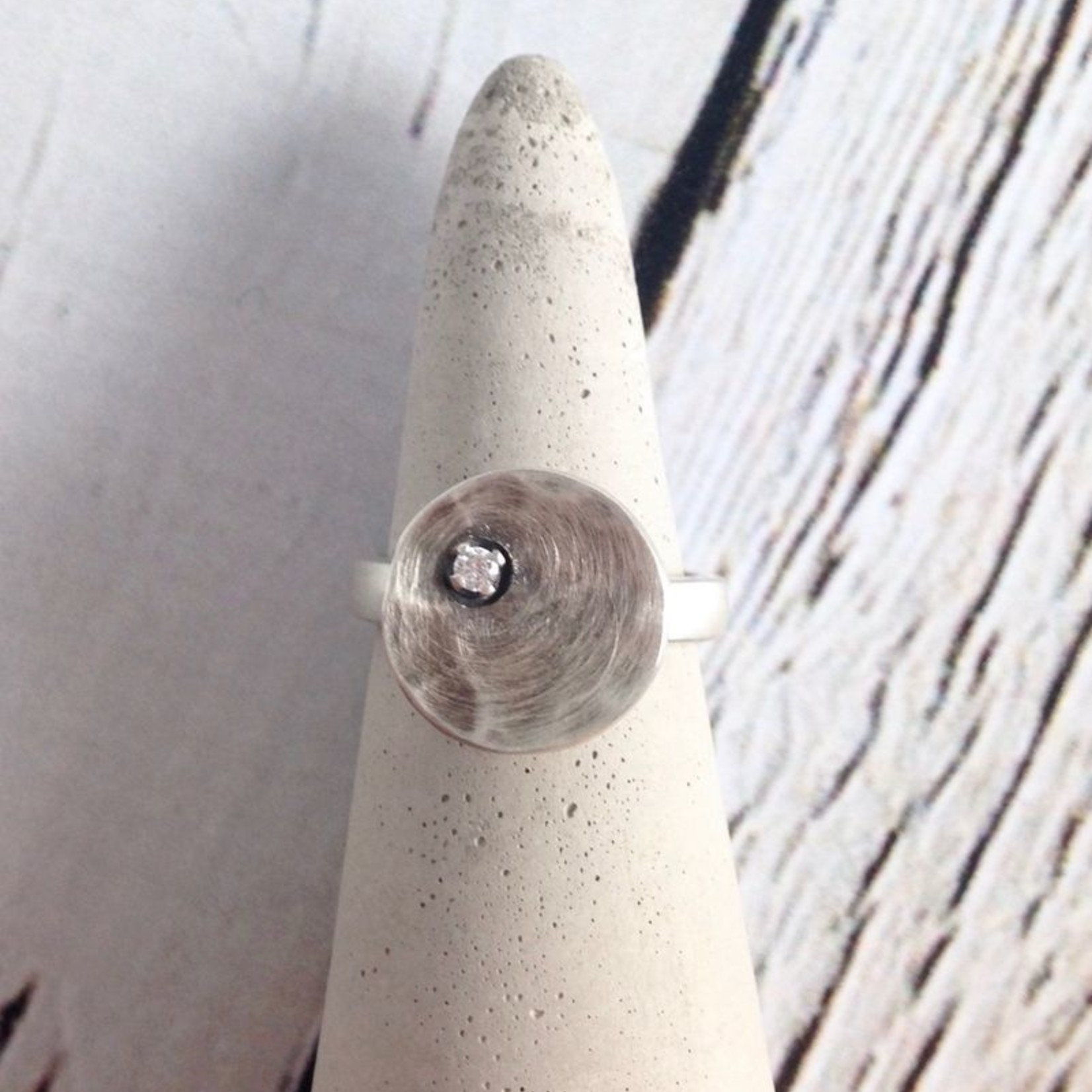 J&I Hammered and Oxidized Sterling Disc Ring with offset 2mm White Bezel Set CZs