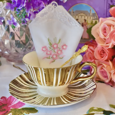 White and Gold Teacup and Saucer