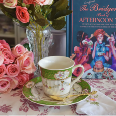 Green and White Teacup and Saucer