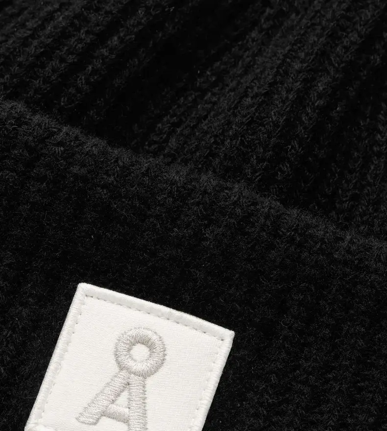 TUQUE EN LAINE ICONIC Å
