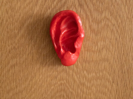 Renaud Sauvé Red Carved Porcelain Ear on White Oak Stand