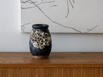 Antique Antique Japanese Octopus jar with black glaze and large barnacles